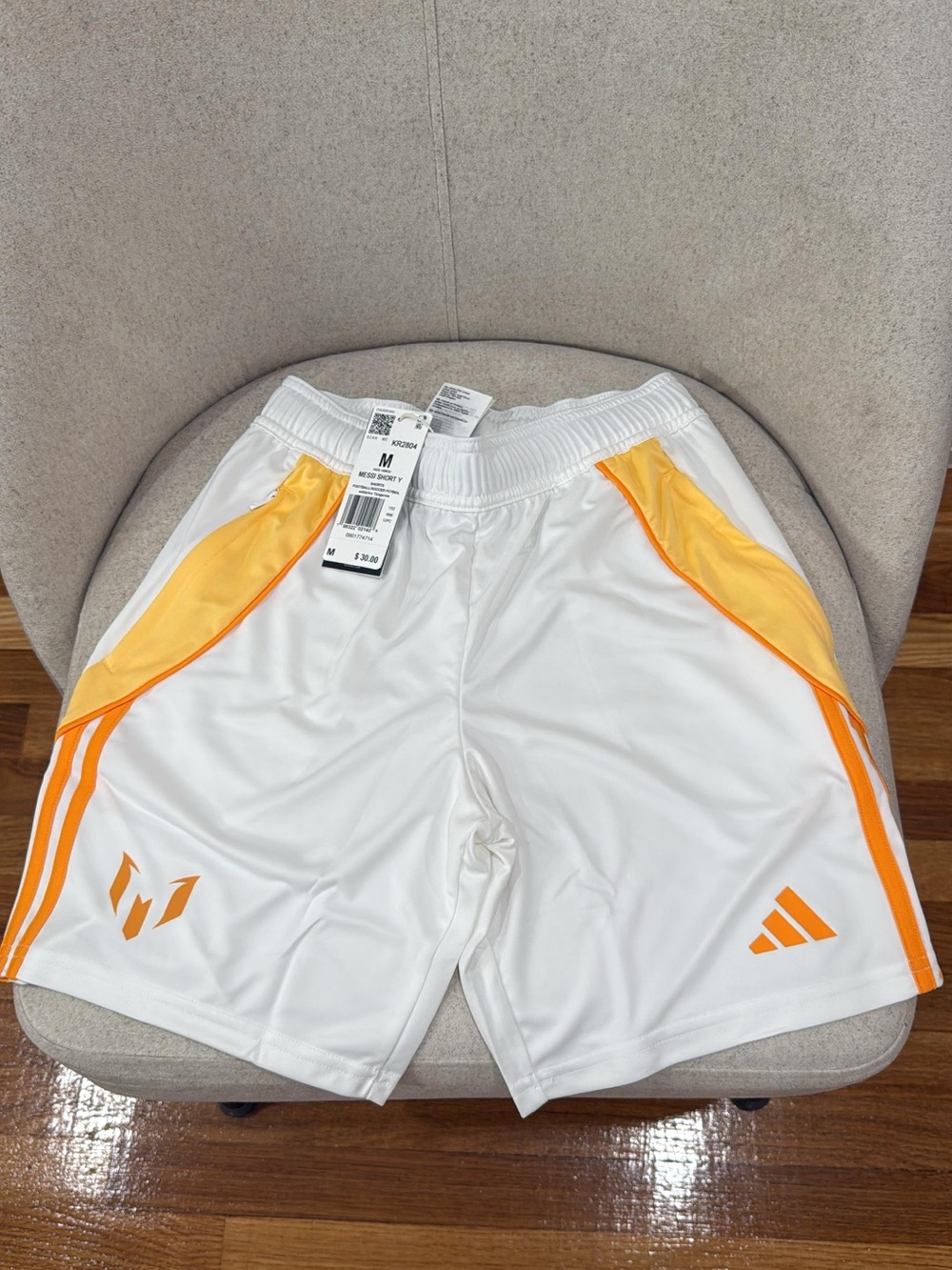 Adidas Messi Kids White Athletic Shorts with Orange Accents